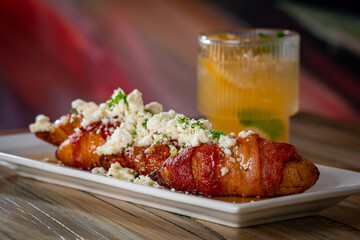 Bacon Wrapped Plantains topped with Feta.