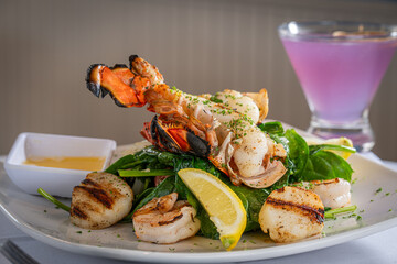 Lobster Tail, Shrimp and Scallop Dinner with a Cocktail.