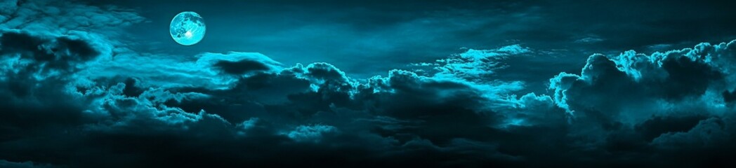 Fototapeta premium Night sky with clouds. Dark dramatic sky background with space for design. Web banner. Wide. Panoramic. Website header. Midnight.