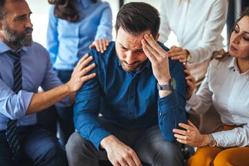 Colleagues Showing Support to a Stressed Team Member in Workplace