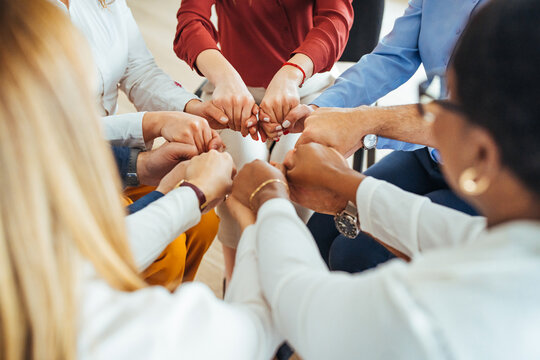 Team Members Supporting Each Other with Firm Handclasps in Unity