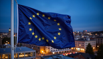 European Union flag waving at twilight over city lights, symbolizing unity