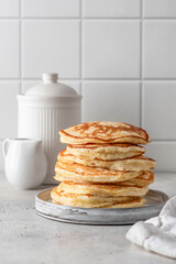 Homemade pancakes on white kitchen table background. Pancake day traditional meal