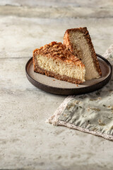 Slice of homemade cottage cheese cheesecake on textured background. Healthy organic dessert pie cheesecake. Text space