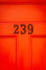 Door number 239 in red