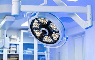 Neurosurgery room lighting setup. Bright surgical lights illuminate a neurosurgery room, ensuring...