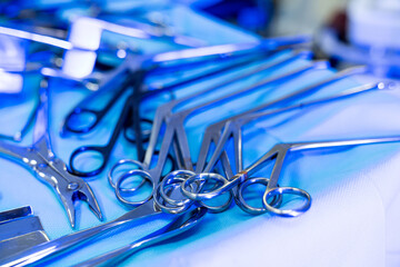 Neurosurgery tools in OR. Surgical instruments are meticulously arranged on a sterile surface in a...