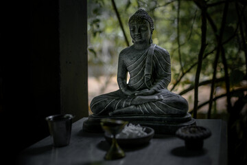 dark stone Buddha statue