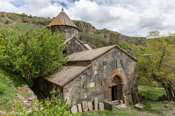 Gndevank Monastery in Vayots Dzor, Armenia, sits within the Arpi River Gorge, surrounded by rugged mountains. This medieval monastery is a historic pilgrimage and tourist site