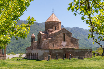 Fototapeta premium Odzun Monastery in Lori, Armenia, stands above Debed River Canyon, offering a stunning view. This historic church is a major religious and cultural landmark in northern Armenia
