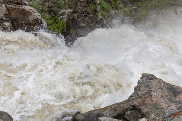 The Arpa River in Vayots Dzor, Armenia, swells with powerful floodwaters from the Kechut Reservoir after heavy spring rainfall, rushing through the Arpa Gorge.