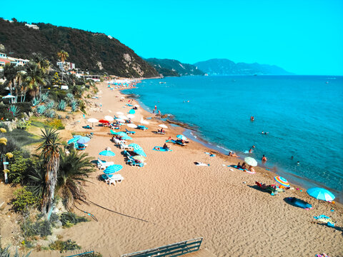 Beautiful drone areal view of Glifada in Corfu, Greece by blue sea