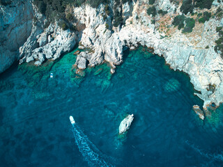 Gorgeous Aerial Drone Shot of a Turquoise Coast blue green sea and rocks 