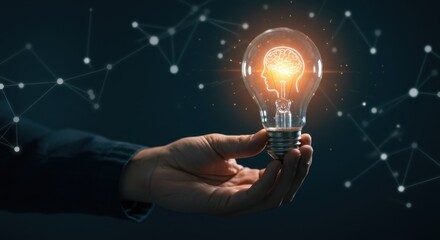 Hand Holding Glowing Lightbulb: Innovation and Ideas