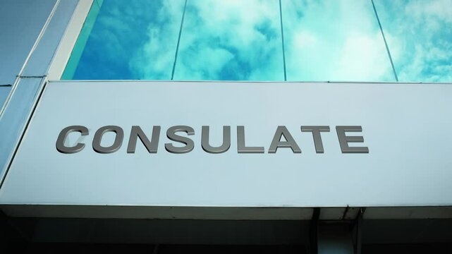 Consulate sign on a modern building with glass windows, symbolizing diplomatic services, international relations, and foreign representation