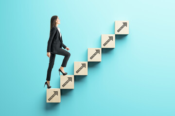 Businesswoman climbing career success stairs.