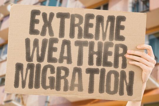"Extreme weather migration" on worn cardboard. Highlights people moving due to harsh weather. DISPLACEMENT. EVACUATION. CRISIS. DISASTERS. FLOODS. DROUGHTS. WILDFIRES