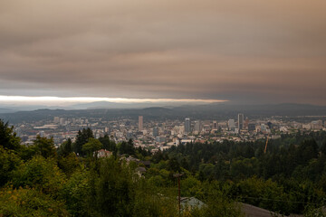 Portland and Mount Hood nearly hidden under dense wildfire smoke, seen from Pittock Mansion. The 2020 wildfires left the city engulfed in thick haze and poor visibility