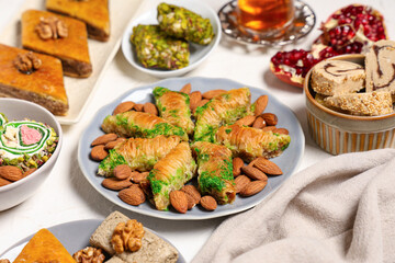 Plates with different Eastern dishes on light table. Ramadan celebration
