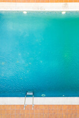 partial view of a swimming pool in a family house, aerial top view with drone
