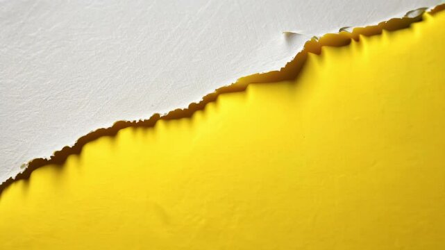 Torn white paper on vibrant yellow background, uneven frayed edges minimalist high contrast, close-up view