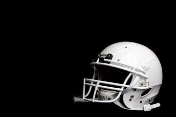 Fototapeta premium Side profile of white football helmet isolated on black background