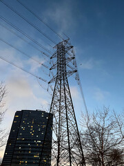 Electric transmission tower with buildings silhouette in Istanbul, Turkey.