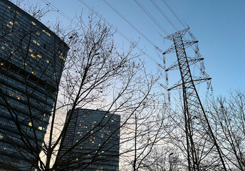 Electric transmission tower with buildings silhouette in Istanbul, Turkey.