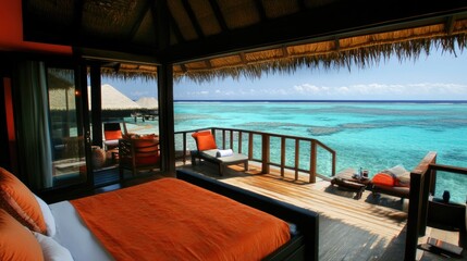 Fototapeta premium Coastal resort suite with an open balcony, elegant furniture, and a clear turquoise ocean view.