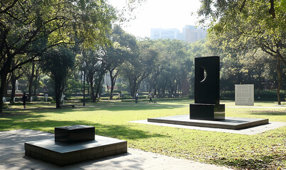 Park sculpture, sunlight, urban setting