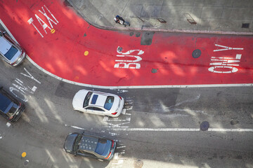 Aerial view of a city intersection with designated taxi and bus lanes