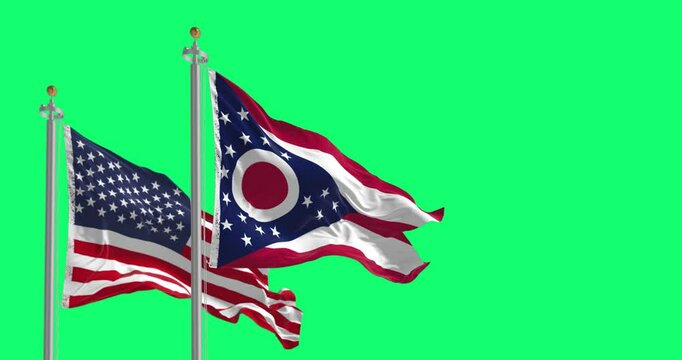 Ohio and national US flags waving isolated on green background