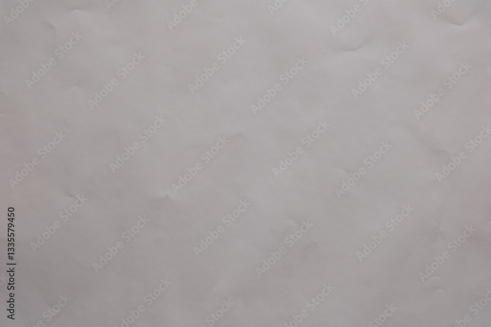 Poster texture and abstract background: the subtle play of light and shadow on a crumpled off white sheet c