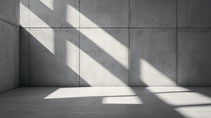 Sunlight casting strong shadows across a modern concrete rooms surfaces