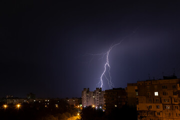 bright lightning in the night sky over the city