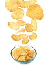Tasty potato chips falling into bowl on white background