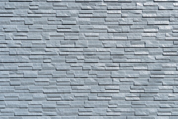 表面に凹凸のある細かな石の壁