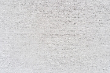 ざらついた表面をした白い壁