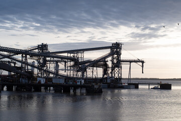 huge ore loading terminal at sunset