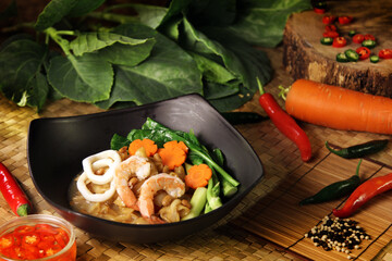 famous noodle food concept Delicious seafood dish with shrimp, squid, and vegetables