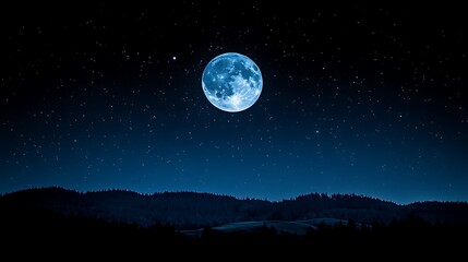 Full moon over dark silhouette hills and starry night sky.