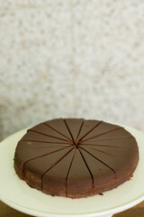 flourless chocolate cake sliced into pieces at catered event, room for copy