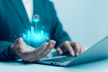 Businessman hold virtual target icons for business objective. Strategic planning for business growth and target customer group. set up business objective target goal.value, growth,	
