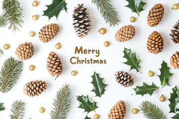 Festive Christmas composition with pine cones, holly and golden ornaments