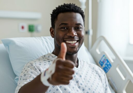 Smiling patient giving thumbs up while recovering in hospital bed for positive health outcomes