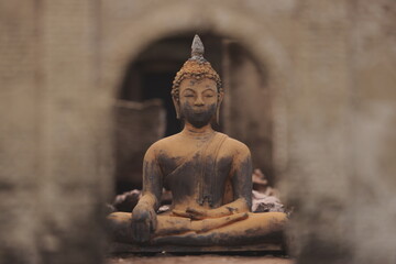 A Serene Buddha Statue Framed Beautifully Within Stunning Ancient Architecture Structures