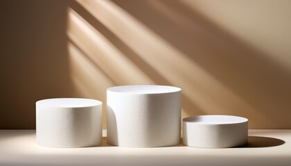 minimalist product display with three white round podiums on beige background with sunlight