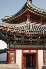 Fototapeta premium A building with a red roof and white trim