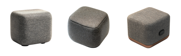Set of compact Bluetooth speakers with stylish fabric covering positioned at a slight angle isolated on a white or transparent background.