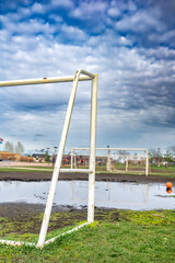 Soccer Goal in the Middle of a Muddy Field